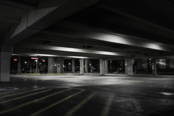 empty dimly light parking garage